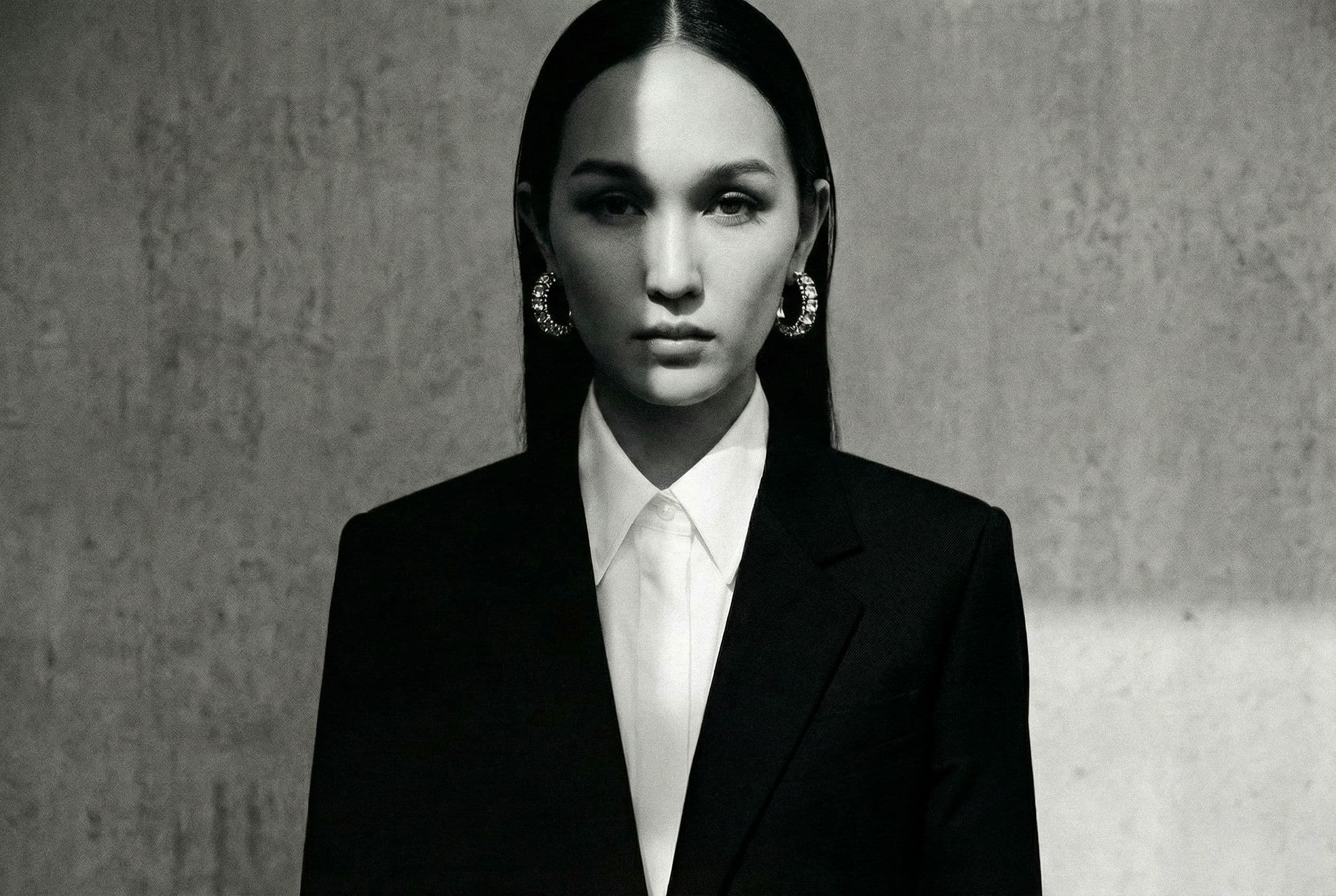 A portrait of a woman in a tailored jacket